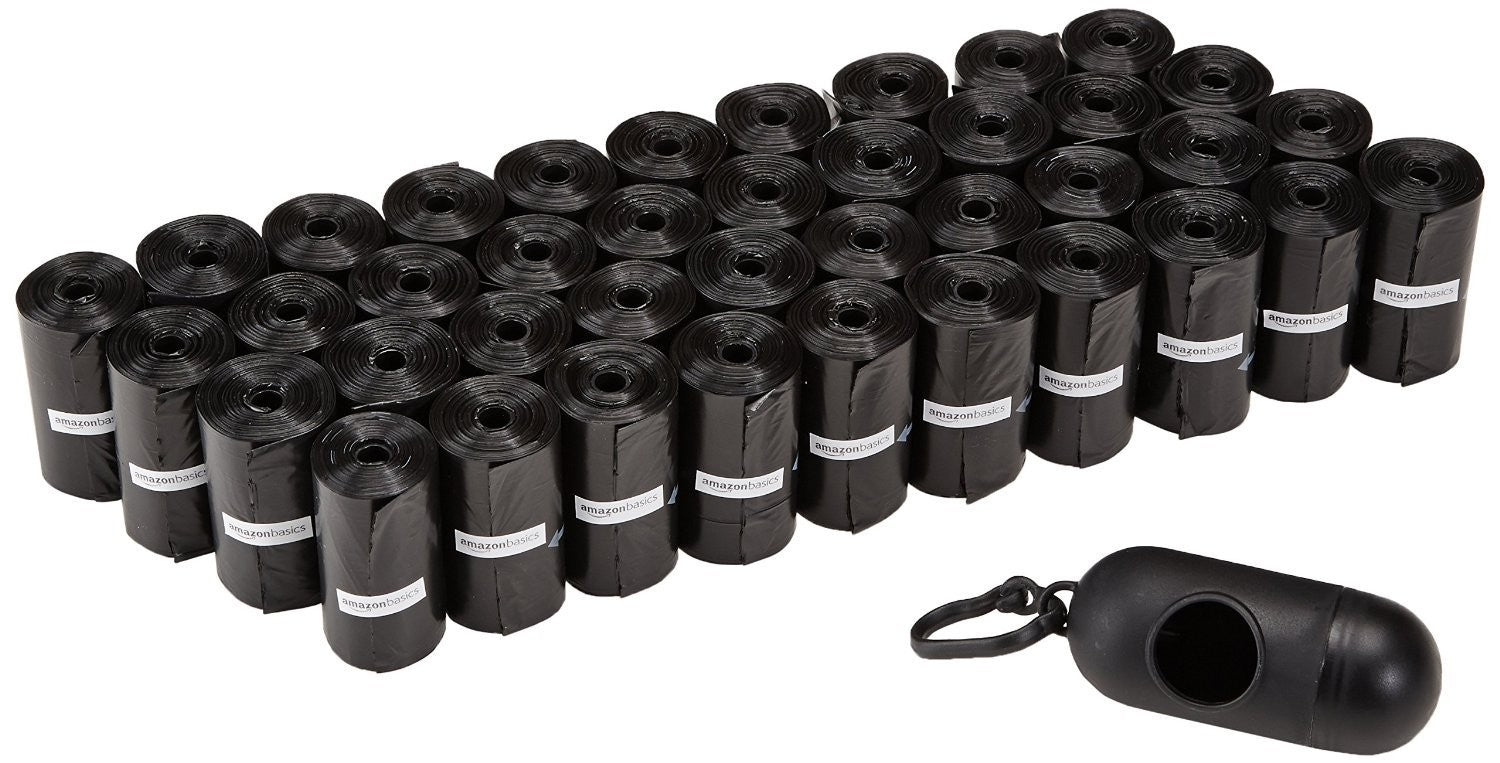 Amazon Basics dog waste bags and training pads, showing 10 packs of waste bags and training pads for pet cleanup and training.