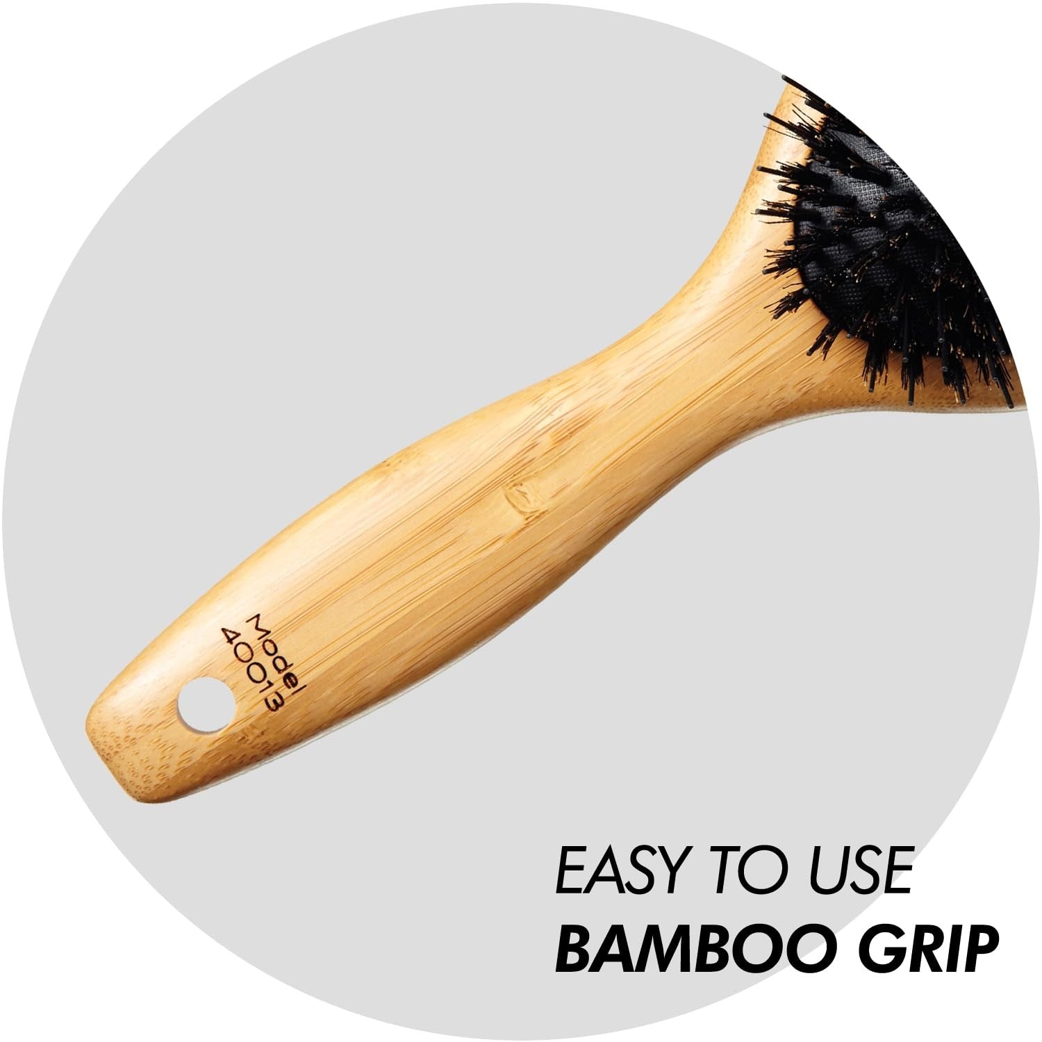 Sam Villa Signature Series boar bristle hair brush for styling, with natural bristles and ergonomic handle for smooth hair grooming.