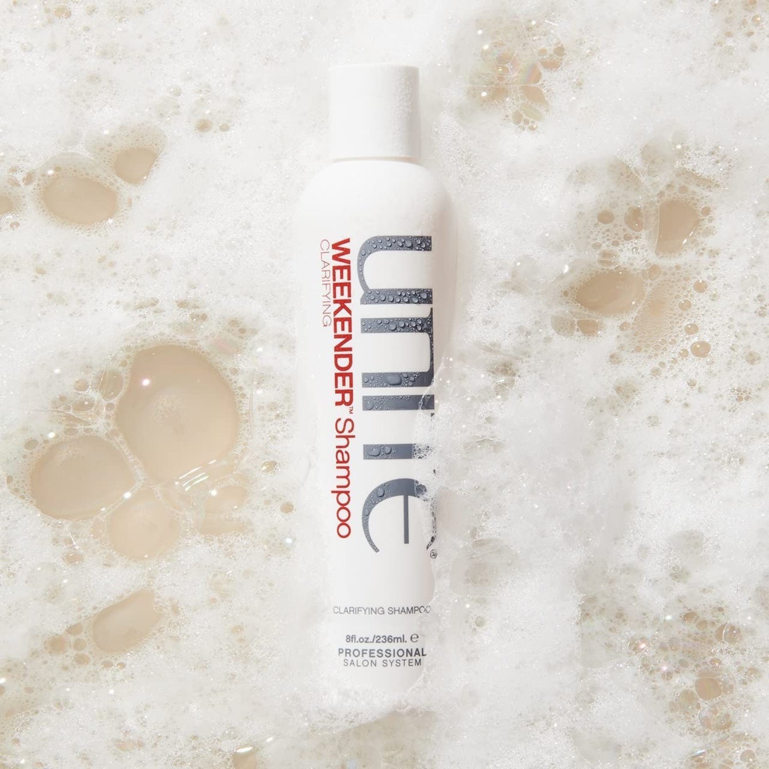 UNITE Hair Weekender Shampoo bottle with clarifying formula for removing product build-up, shown in a sleek, professional design.