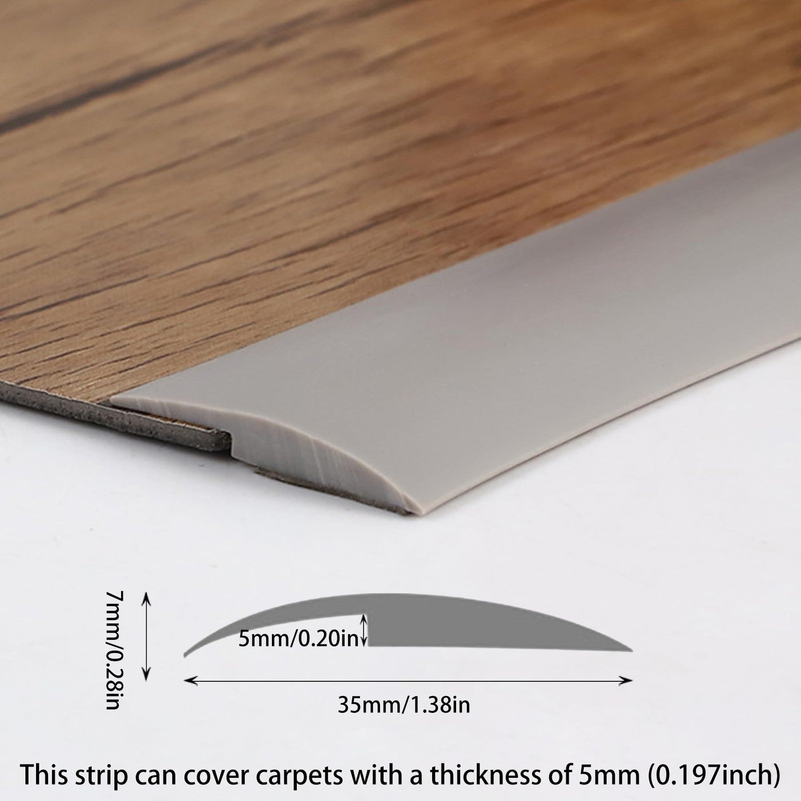 Trimold grey self-adhesive carpet to tile floor transition strip edging showing a close-up of the adhesive-backed edging on a floor surface.