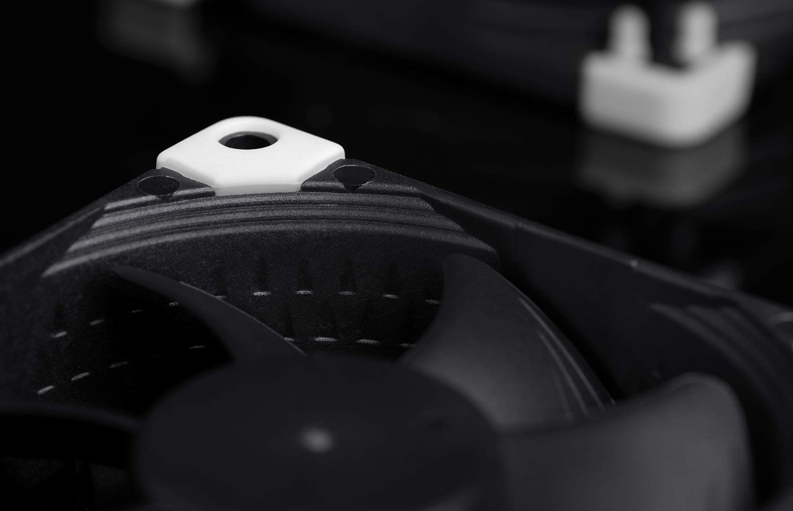 Noctua NF-A8 PWM chromax.Black.swap 80mm quiet black computer fan mounted on a heatsink with black anti-vibration pads