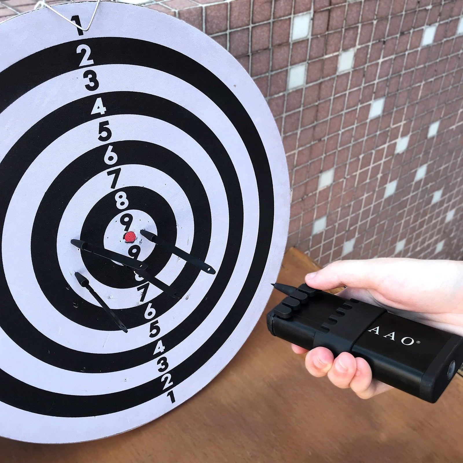 HUAAO upgraded ballistic dart launcher with metal darts, featuring a sleek design and accurate shooting for target practice.