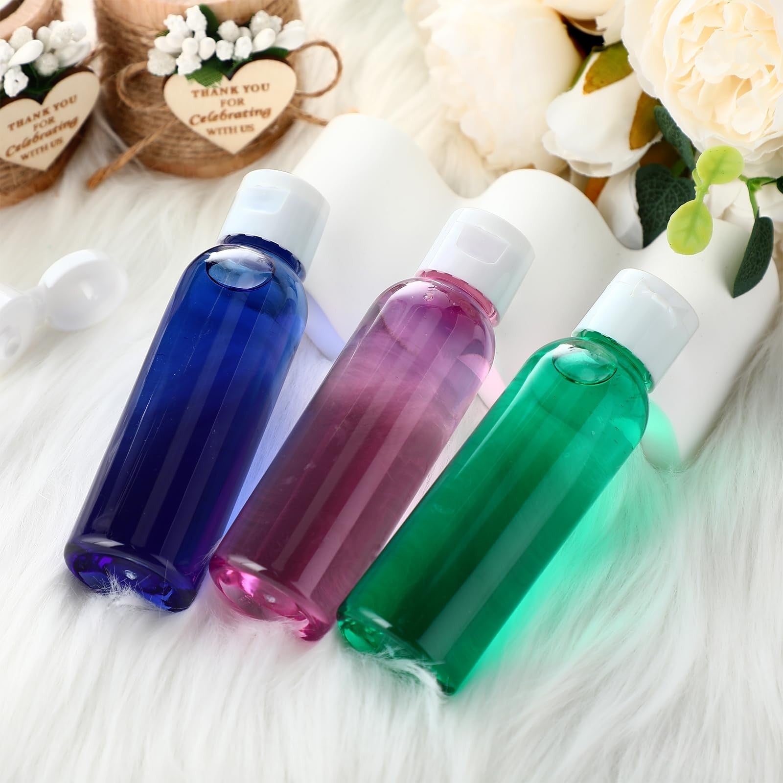 Zhehao 200-pack of 2oz clear plastic travel bottles with flip cap liquid dispensers, ideal for toiletries and liquids.