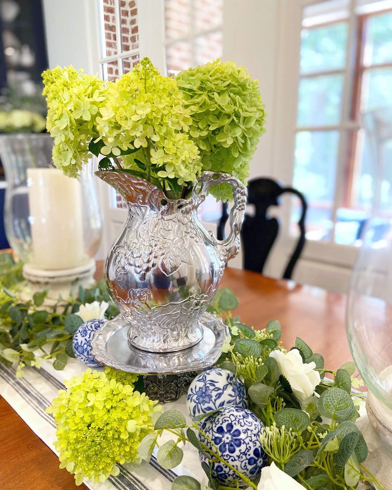 Arthur Court metal vineyard pitcher with grape pattern, sand cast aluminum design, showcasing intricate grapevine details.