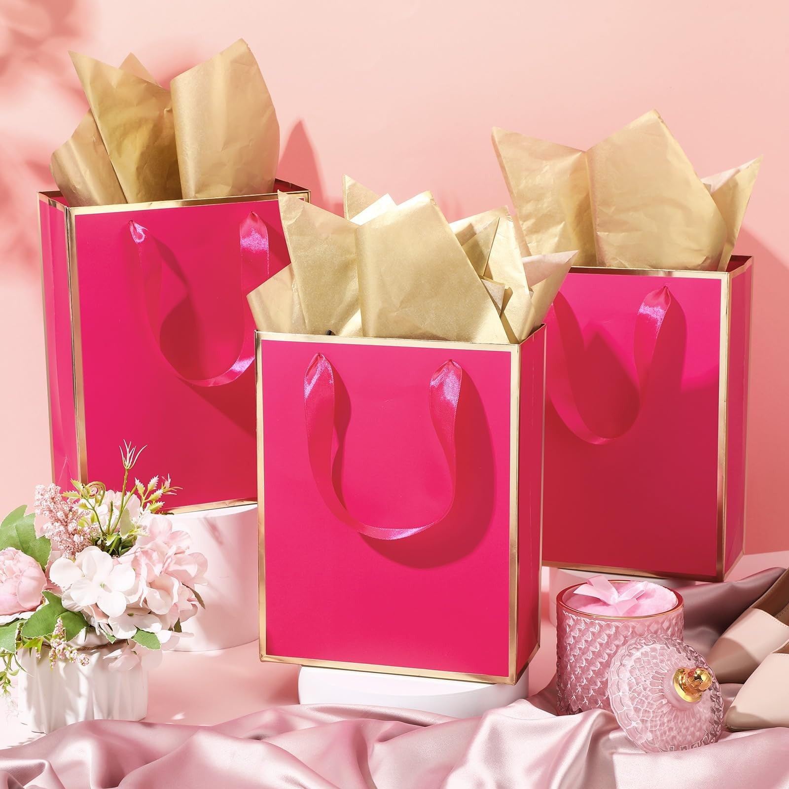 Yeaqee 50-pack metallic gold gift bags with handles and tissue paper, ideal for party favors and gift packaging.