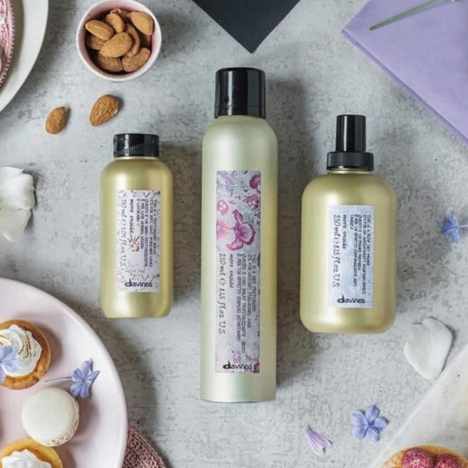 Davines This is a Texturizing Serum bottle with a pump dispenser, showcasing the product's sleek design and label.
