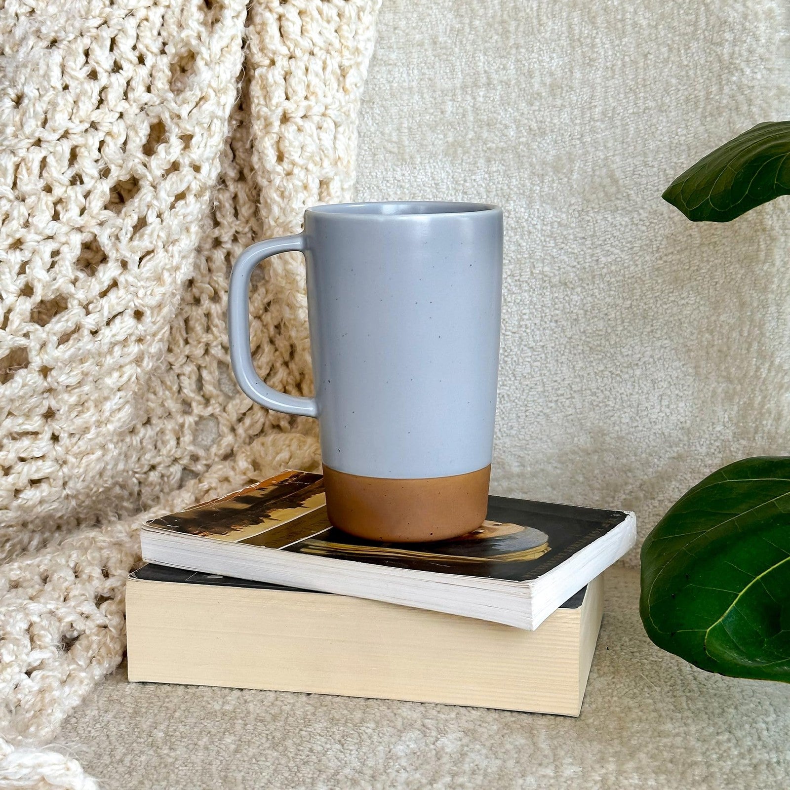 Large Mora Ceramics Hit Pause tea mug with loose leaf infuser, ceramic handle, and modern design for hot beverages.