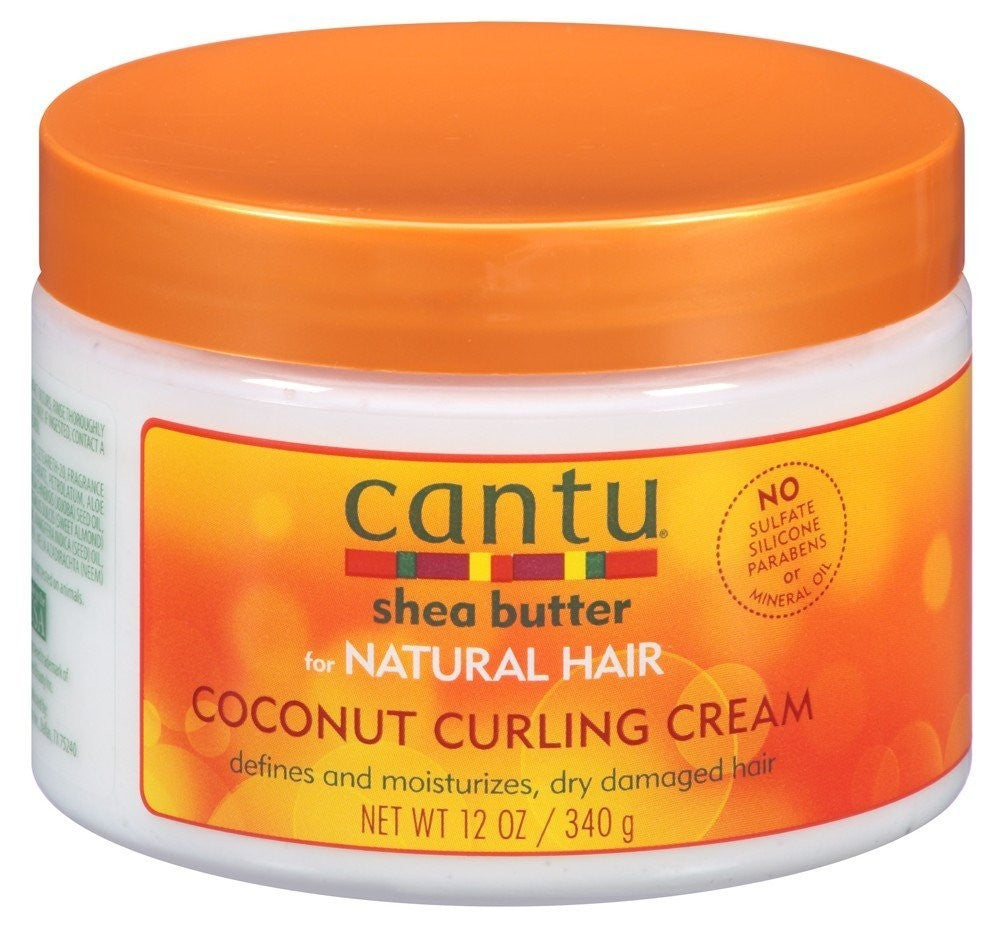Six 12oz jars of Cantu Coconut Curl Cream for defining and moisturizing curly hair, featuring creamy texture and coconut scent.