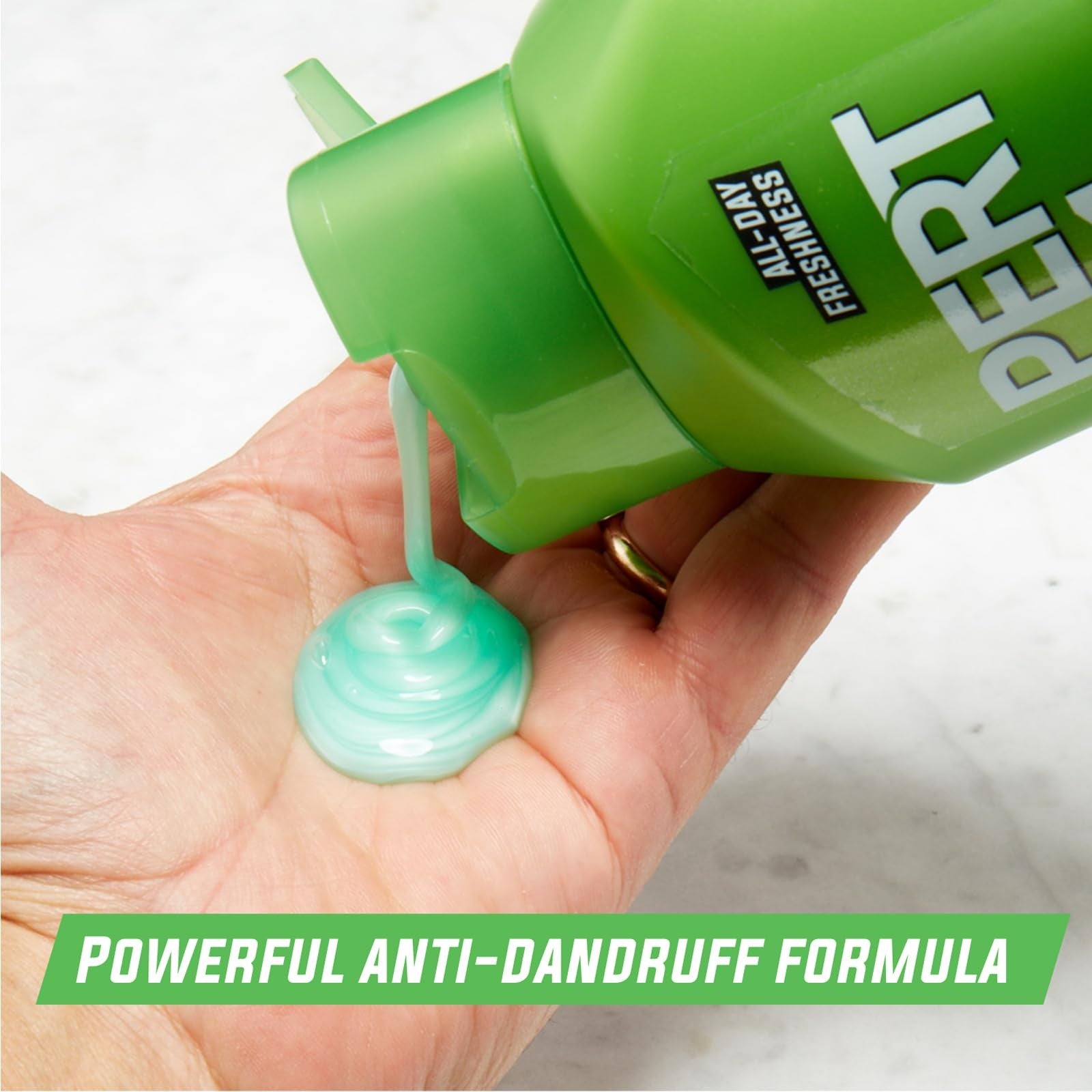 Pert Plus 2-in-1 shampoo and conditioner for dandruff control, 25.4oz bottles, pack of four, with bottles and label visible.