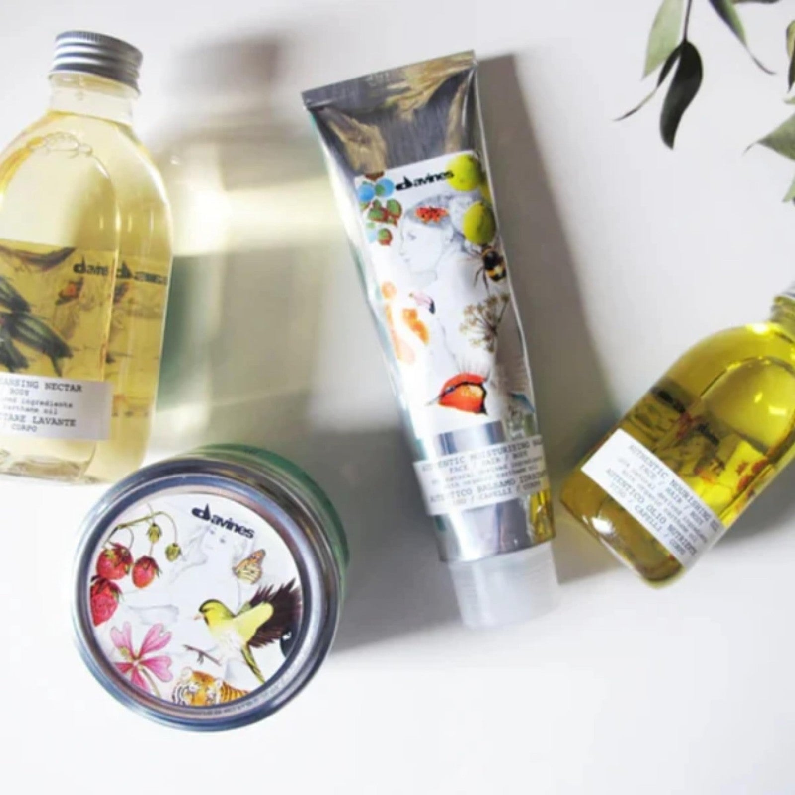 Davines Authentic Moisturizing Balm, multi-functional conditioner for face and hair, in a sleek jar with a white lid.