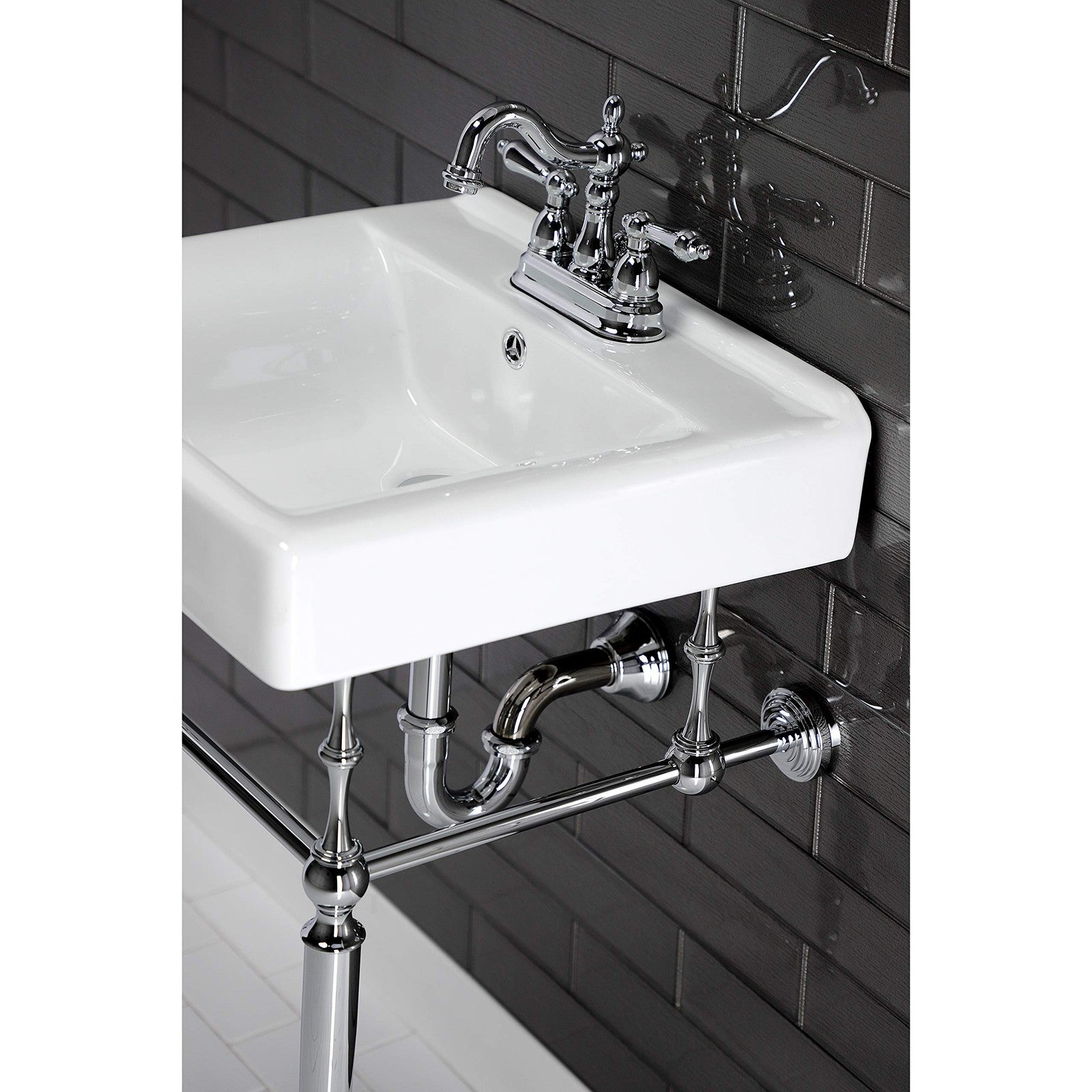 Kingston Brass Heritage 4-inch centerset lavatory faucet with metal lever handle, polished chrome finish, and detailed design.