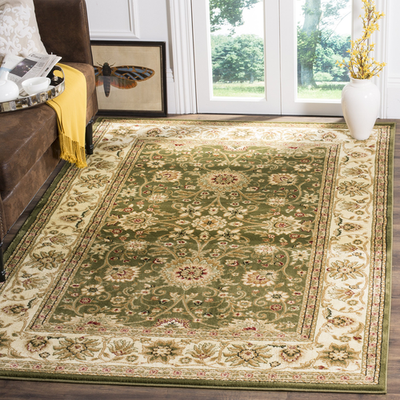 Safavieh Lyndhurst traditional area rug in sage and ivory with intricate patterns, measuring 53 square feet.