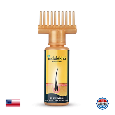 Two 100ml bottles of Indulekha Bringha Complete Hair Care Oil, clear bottles with dropper caps and herbal labeling.