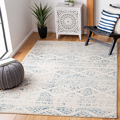 Safavieh Tulum Collection 6x9 ivory and turquoise Moroccan boho tribal area rug with geometric tribal patterns.
