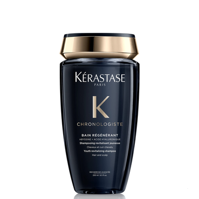 Kérastase Chronologiste regenerating shampoo for dull, sensitized hair, featuring sleek gold and black packaging with a pump dispenser.