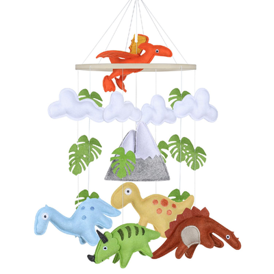 Handcrafted felt dinosaur baby mobile with colorful dinos, clouds, and mountain, eco-friendly nursery decor for crib, gender neutral dinosaur baby mobile.