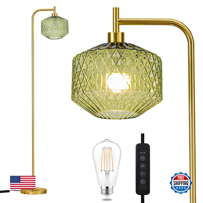 Emerald green ribbed glass floor lamp with a mid-century modern design and standing base, unbranded.