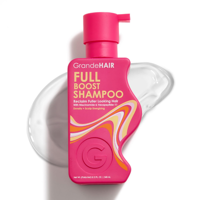 Grande Cosmetics GrandeHAIR Peptide Shampoo for hair thickening and reducing fallout, showing the shampoo bottle and hair strands.