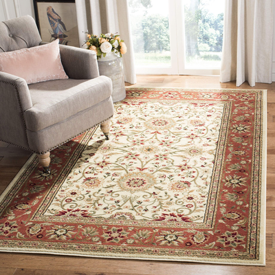Safavieh Lyndhurst traditional accent rug in ivory and rust with intricate patterns, measuring 33x53 inches.