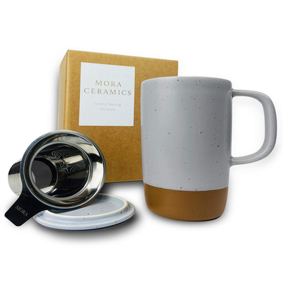 Large Mora Ceramics Hit Pause tea mug with loose leaf infuser, featuring a ceramic body and ergonomic handle.