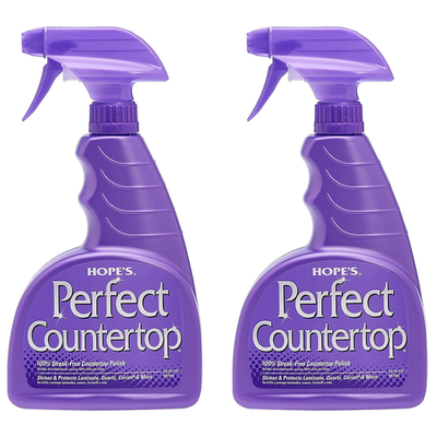 Hope's Hope Perfect Countertop Cleaner and Polish 22-ounce bottle with spray nozzle, showing a clean, shiny kitchen countertop.