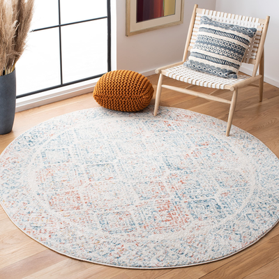 Safavieh Tulum Collection round ivory and terracotta Moroccan boho area rug with intricate patterns and soft texture.