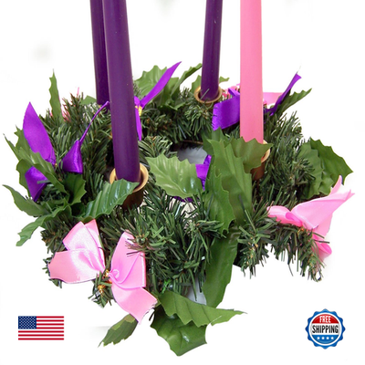 Unbranded Christmas Advent wreath with religious symbols and candles, used as a festive religious centerpiece for holiday celebrations.