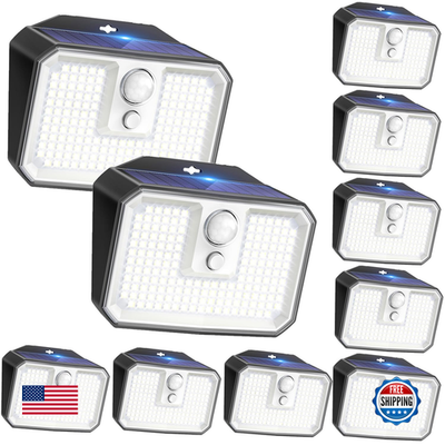 Ten Claoner solar motion sensor outdoor lights with waterproof waterproof 168 LED security lighting system in a daytime outdoor setting.