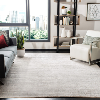 Safavieh Adirondack collection ivory and silver modern ombre area rug with a square shape and subtle gradient design.