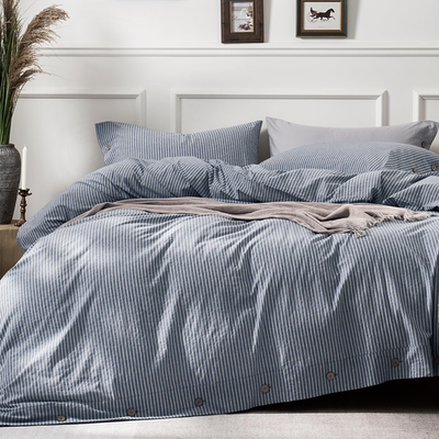 Blue vertical pinstriped Jellymoni cotton king size duvet cover with matching comforter on a bed.