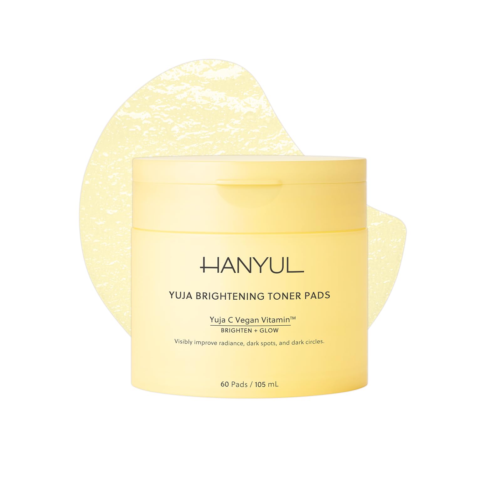 Hanyul Yuja Toner Pads mask showing a jar of bright yellow toner pads with fresh citrus slices and natural ingredients inside.
