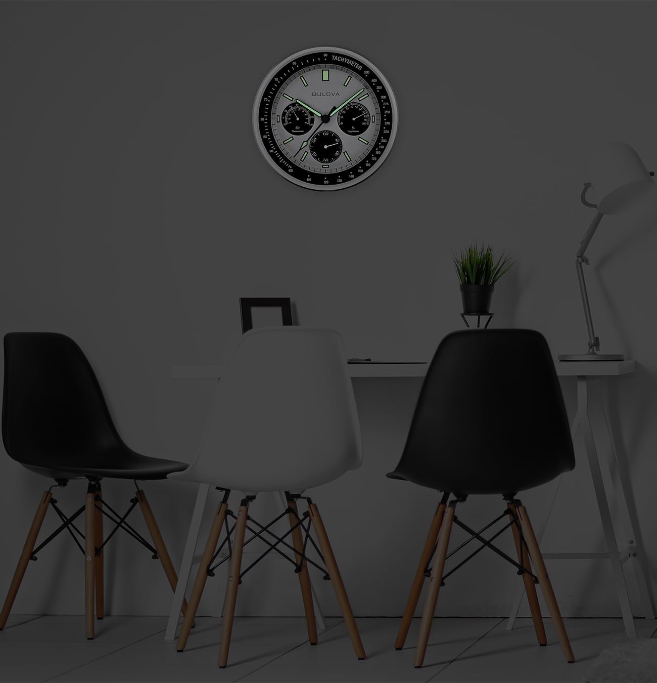 Bulova Lunar Pilot wall clock with matte silver finish and temperature display, featuring a sleek, modern design.