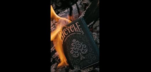 Bicycle Cinder Premium playing cards deck with silver smoke foil design, featuring standard playing card faces and backs.