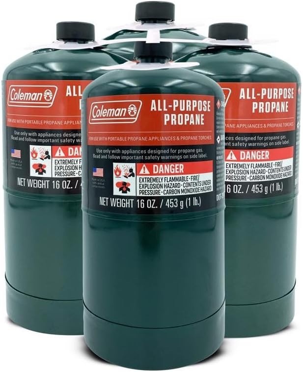 Coleman propane fuel cylinders, 4-pack of 16 oz gas tanks for camping and grilling, shown in a stack with secure caps.