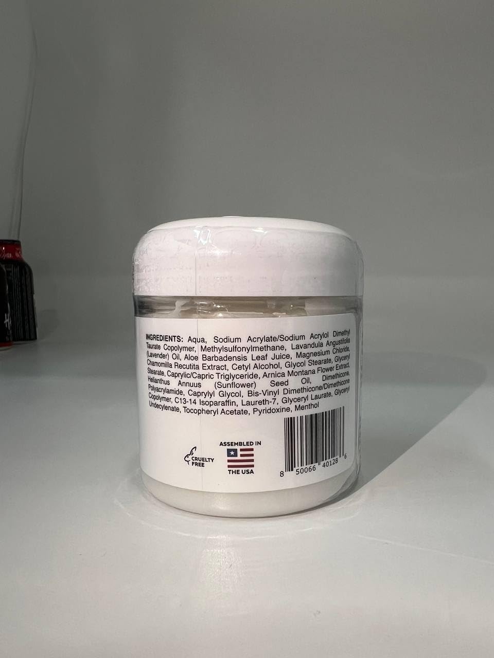 Mama Bear Oasis magnesium cream with arnica and lavender, a soothing skin moisturizer in a jar.