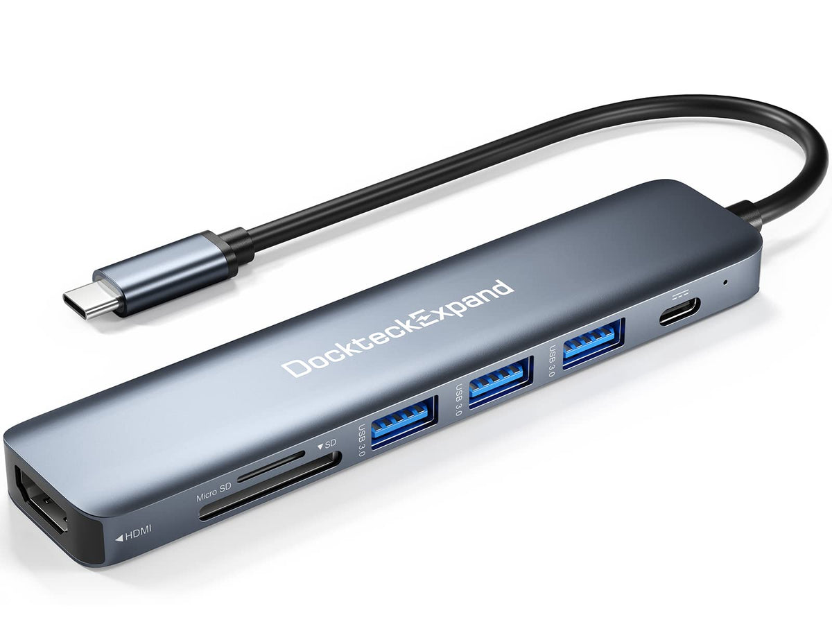 DockteckExpand 7-in-1 USB-C multiport hub with multiple ports including HDMI, USB-A, and SD card reader, connected to a laptop.