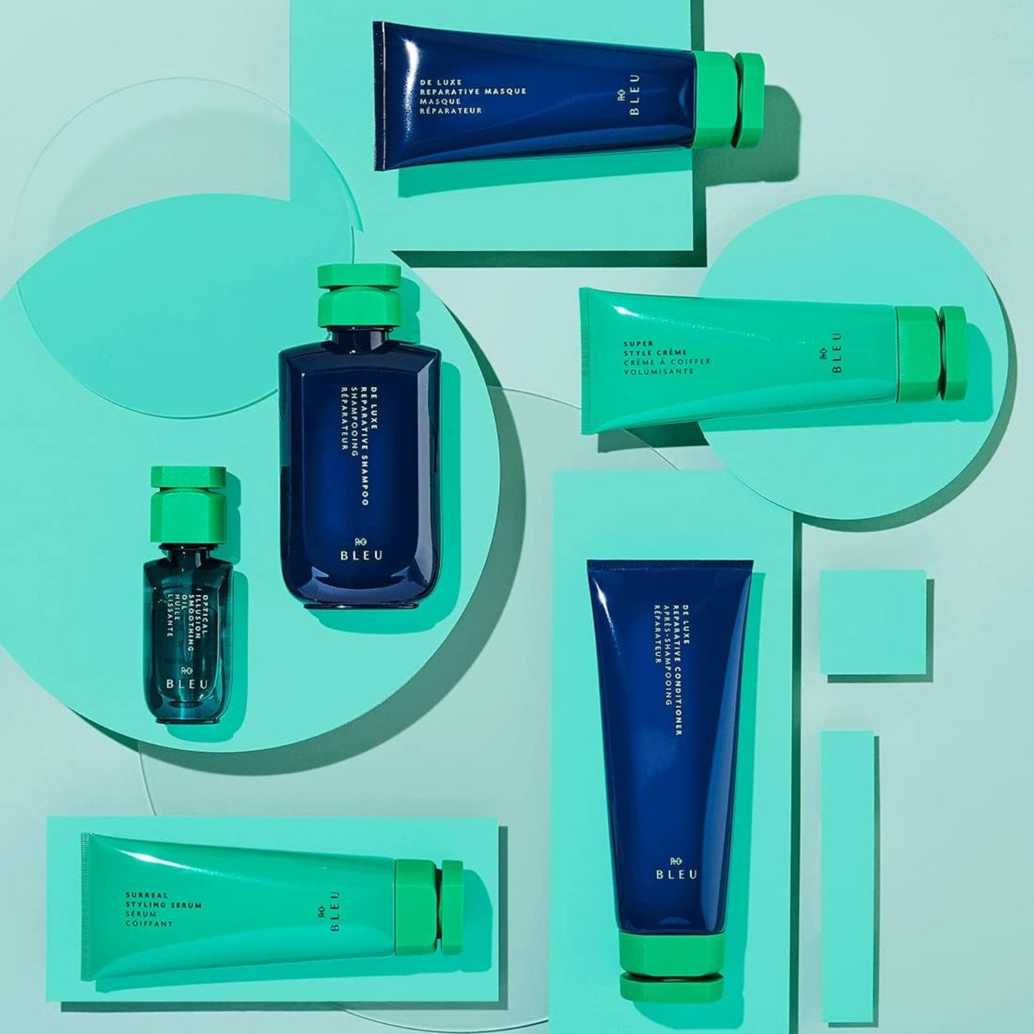 Elefair R+Co BLEU De Luxe Reparative Shampoo bottle showing sleek blue packaging and product label for nourishing hair care.