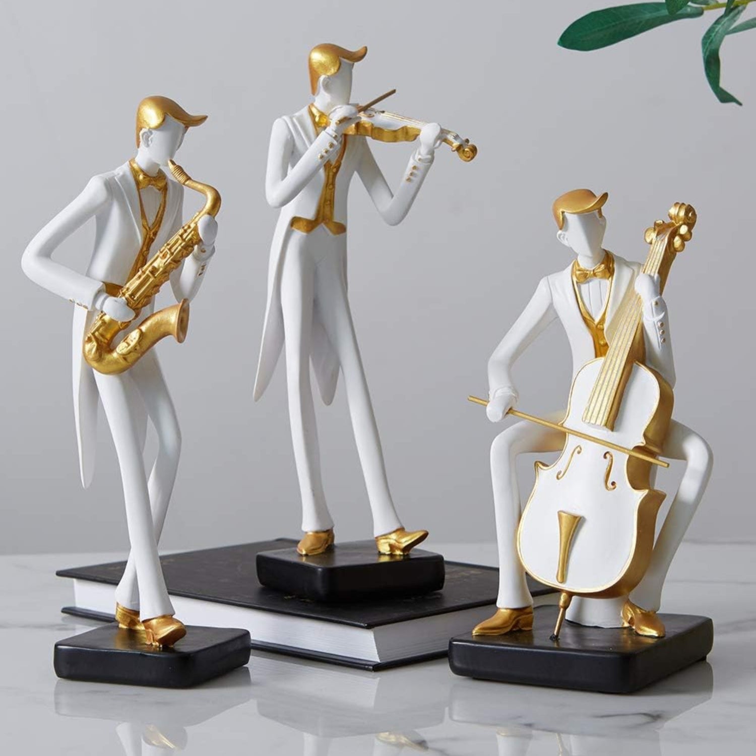 HAUCOZE musician figurine sculpture featuring a cello and piano, detailed music decor statue for home or office decor.
