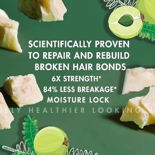 Shea Moisture Amla Oil Bond Repair System bottle with label, featuring natural ingredients for hair strengthening and repair.