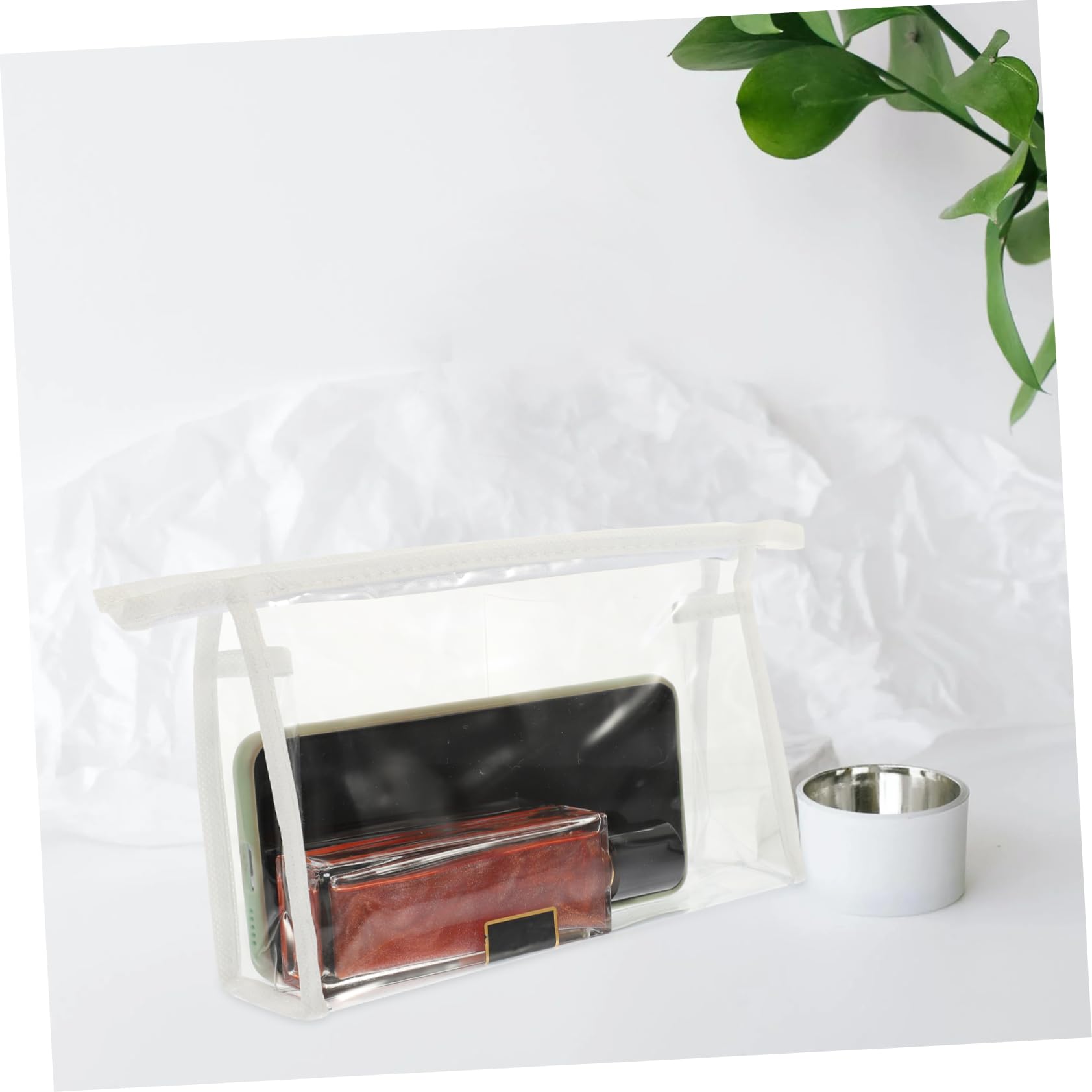 EXQUIMEUBLE white 4-piece travel skincare and toiletry bag set in a compact cosmetic case with multiple compartments.
