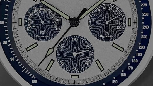 Bulova Lunar Pilot wall clock with matte silver finish and temperature display, featuring a sleek, modern design.