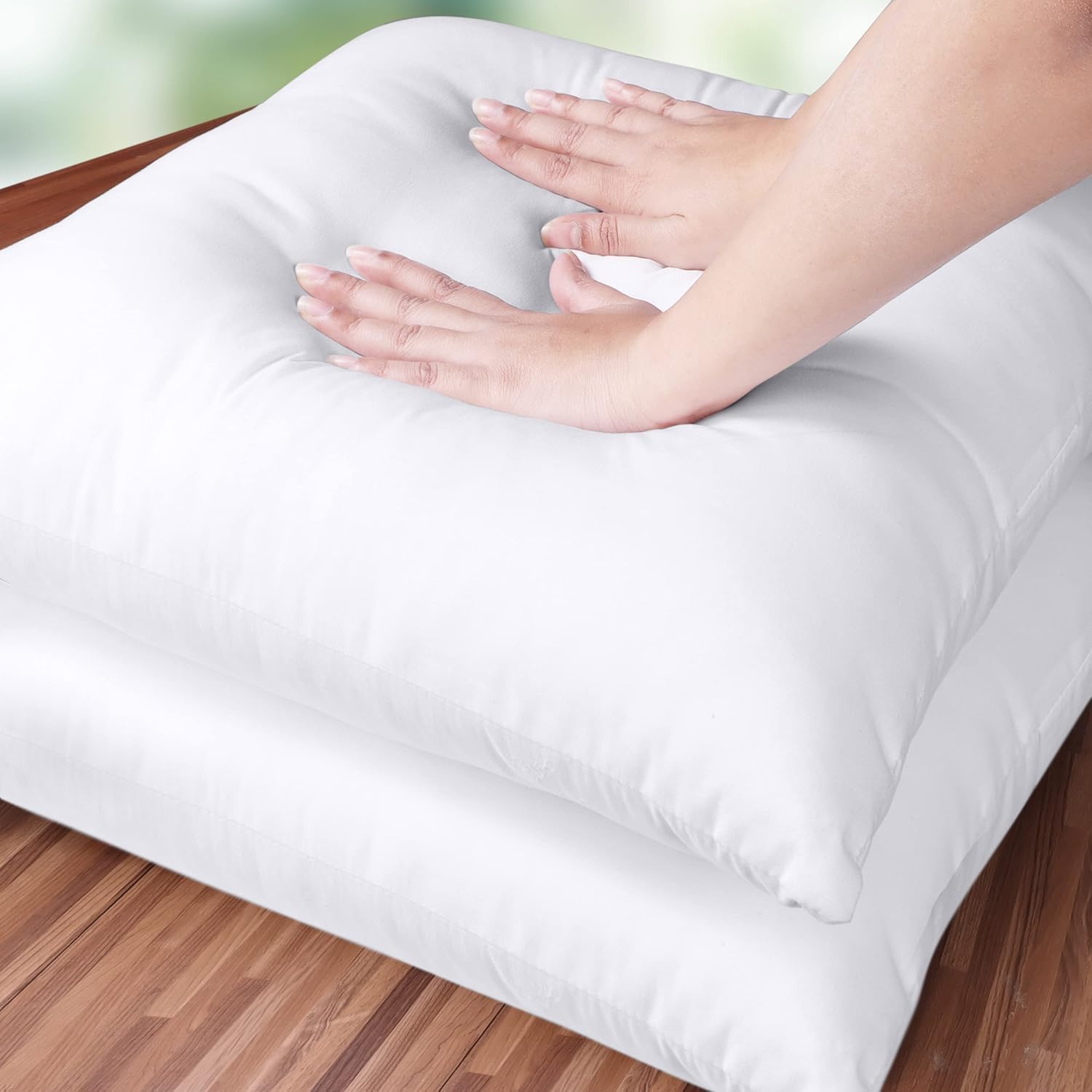Set of two white Utopia Bedding 18x18 pillow inserts for indoor decorative pillows on a sofa or bed.