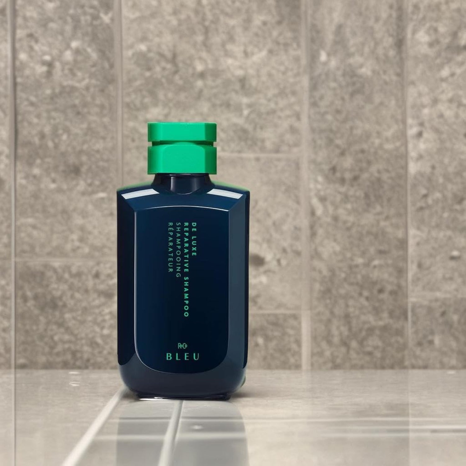 Elefair R+Co BLEU De Luxe Reparative Shampoo bottle, hydrating and strengthening formula for damaged hair.
