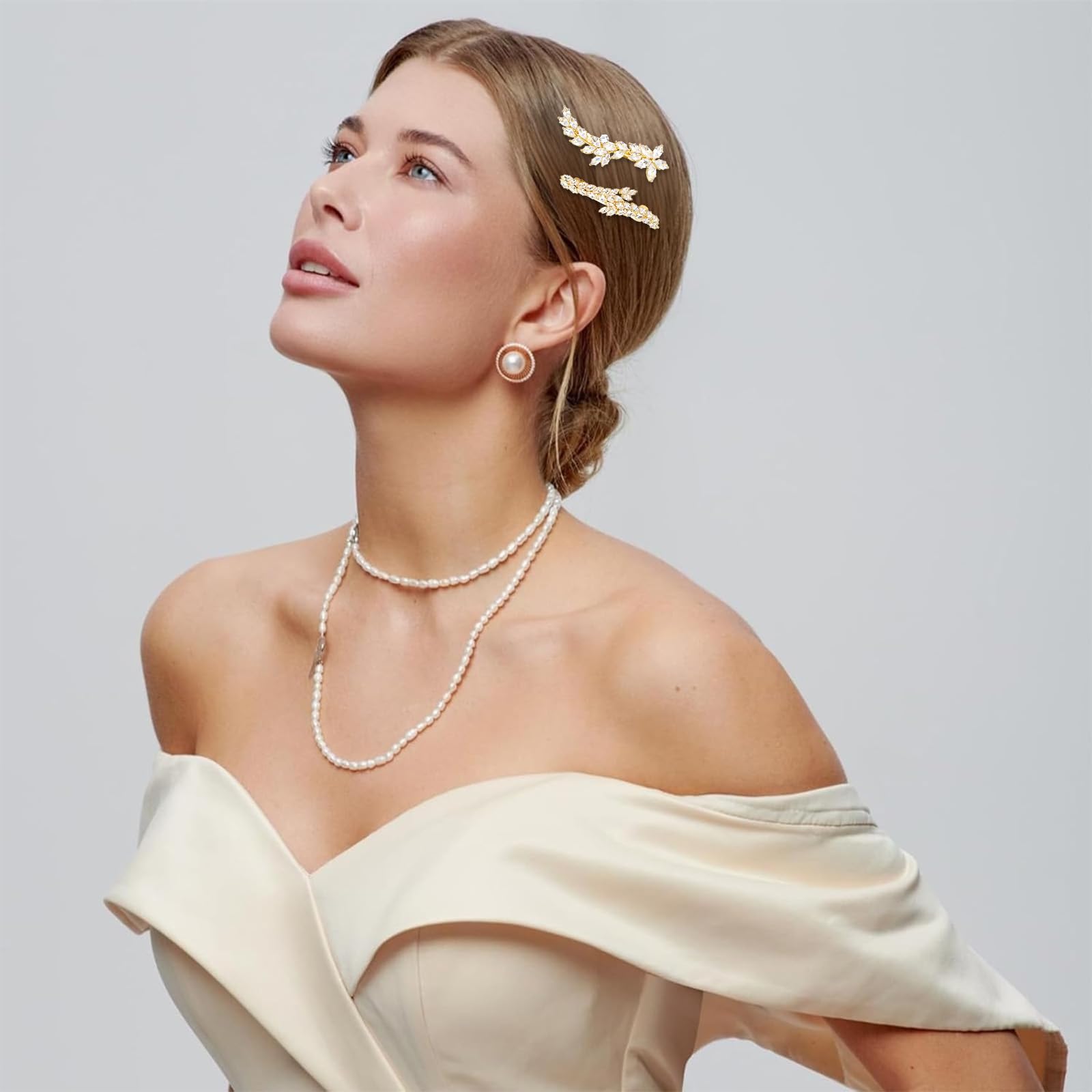 ANBALA gold rhinestone leaf hair clips for women, ideal for wedding hairstyles, featuring elegant leaf design and sparkling accents.