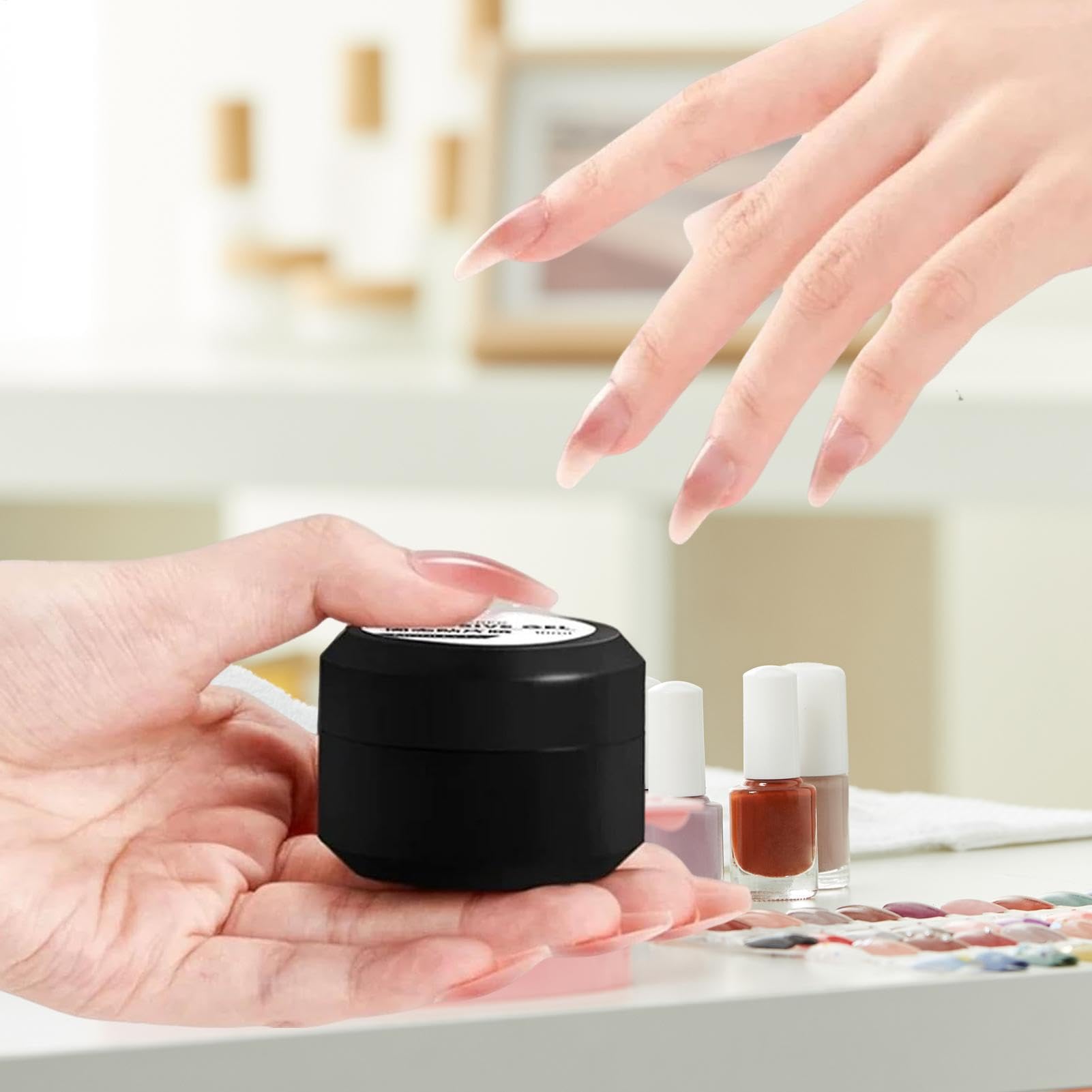 Guyuati Nail Adhesive Gel in 10ml for strong hold on press-on and faux nails, shown in a clear 10ml tube.