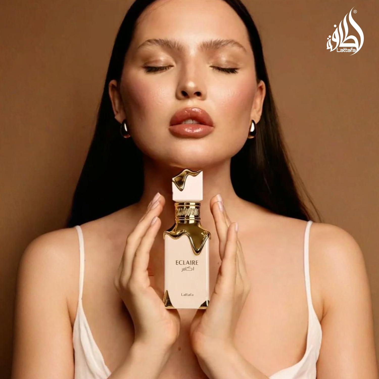 Lattafa Eclaire Eau de Parfum for women, 3.4 oz, featuring vanilla, caramel, floral notes in a long-lasting fragrance bottle.