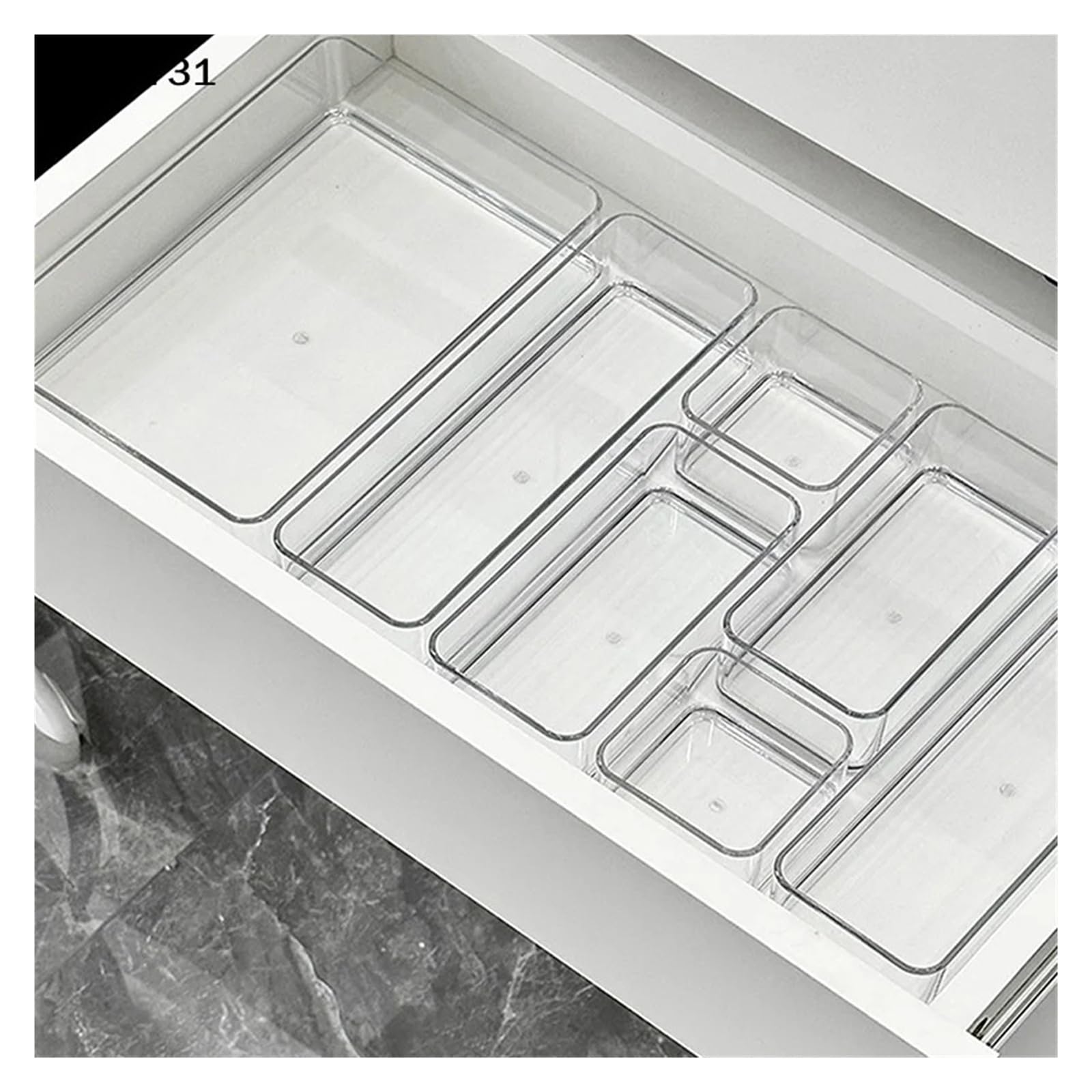 Stackable acrylic caddy with adjustable dividers for cosmetics; modular makeup storage tray with clear, sleek design.