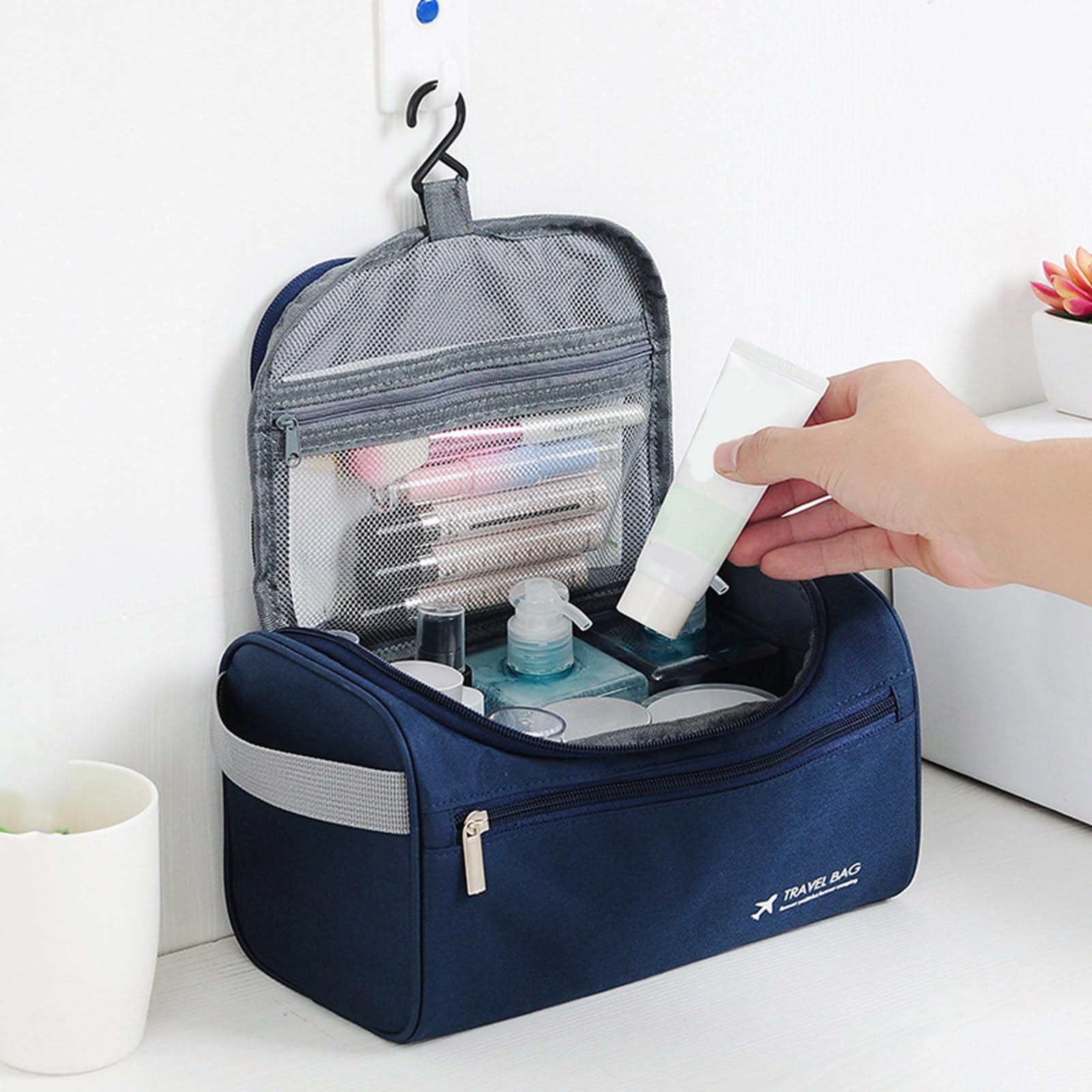 PANFHGFG 3-layer water-resistant makeup bag with hook, spacious camping toiletry storage for travel and outdoor use.