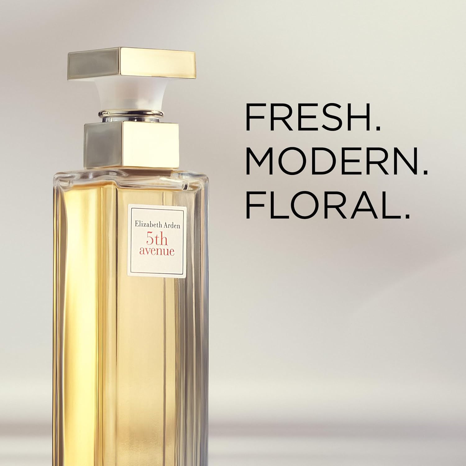 Elizabeth Arden 5th Avenue perfume for women, floral Eau de Parfum bottle with elegant floral design and gold accents.