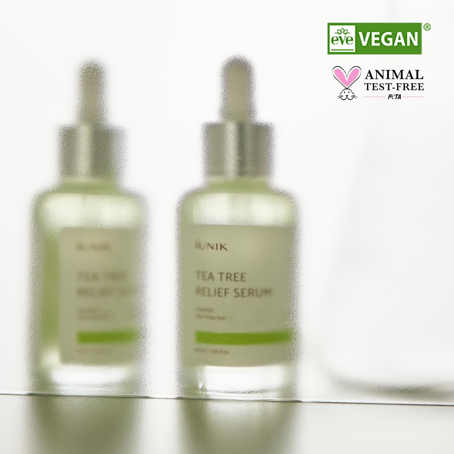 IUNIK Tea Tree Relief Serum calming ampoule in a 1.69 fl oz bottle, featuring soothing tea tree extract for skin relief.